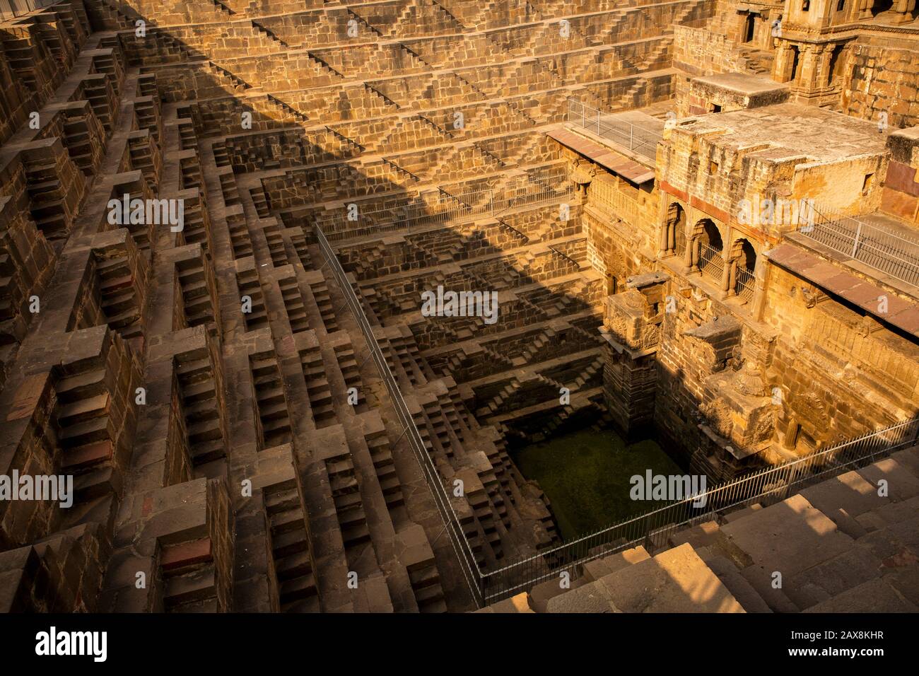 India, Rajasthan, Abhaneri, Chand Baori Stepwell, originating from 8th-9th centuries, view down to water Stock Photo