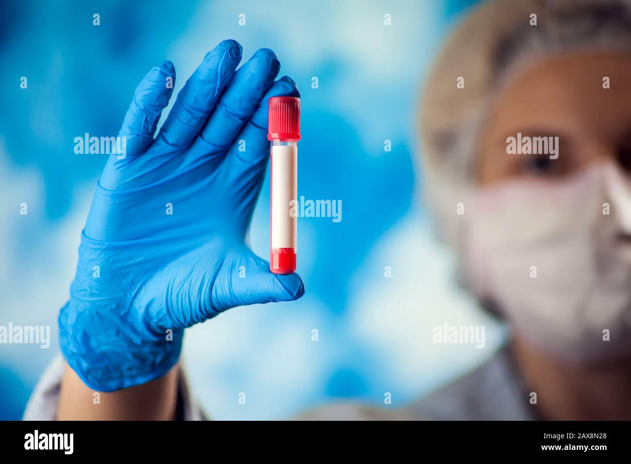 Female doctor holding test tube hi-res stock photography and images - Alamy