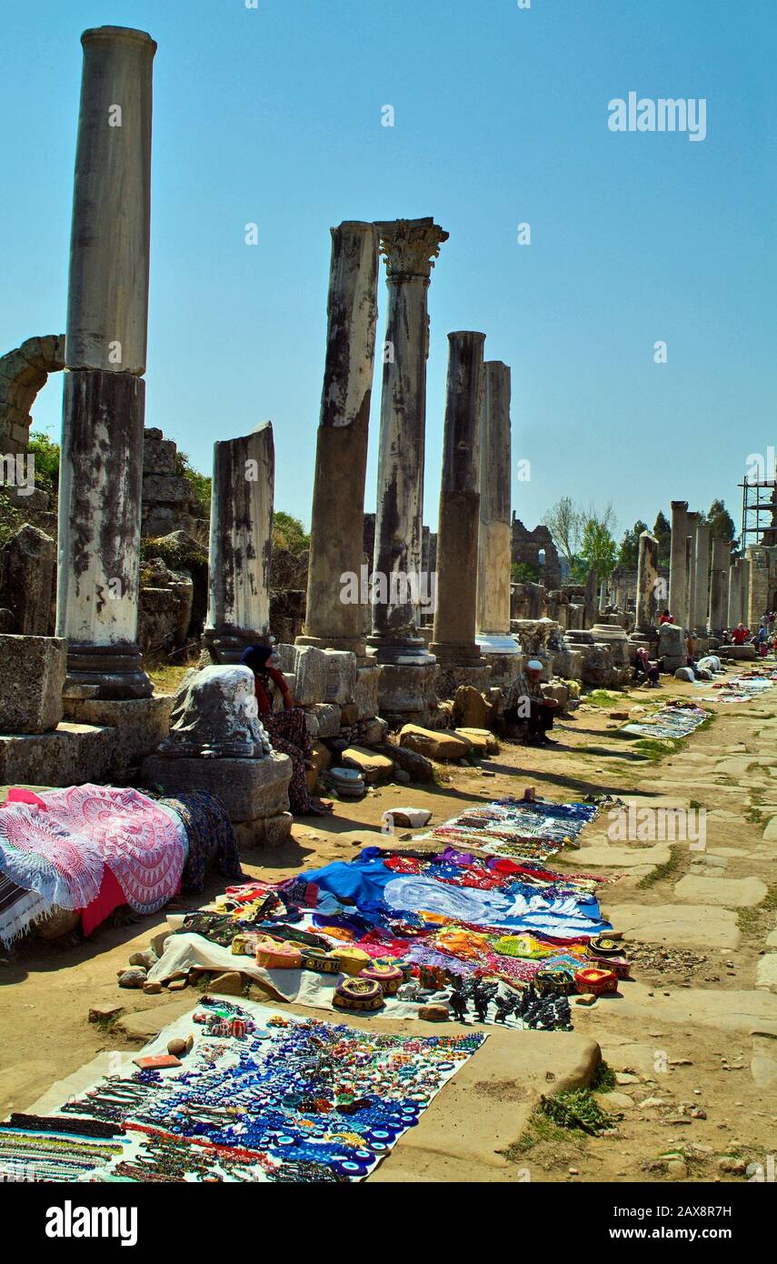 Perge, Turkey - April 12, 2009: Unidentified people sell souvenirs and other goods in ancient city of  Perge, former capital of Greek Pamphylia county Stock Photo