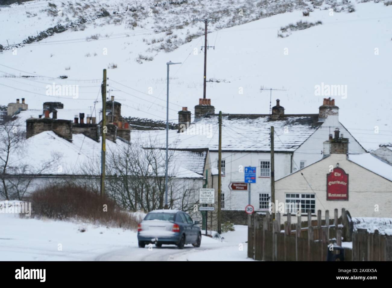 Snow covers houses and surrounding fields in Nenthead, Cumbria Stock
