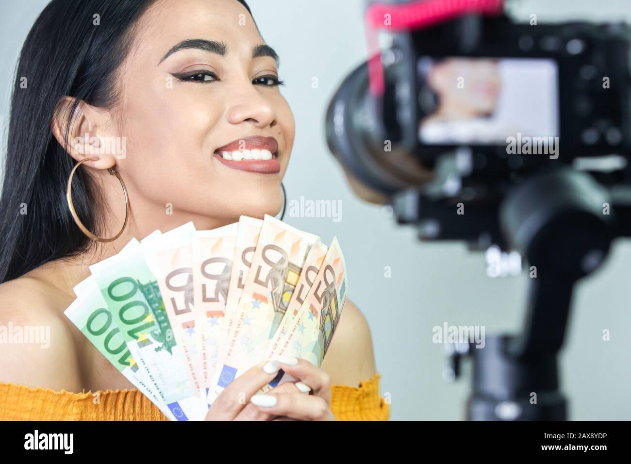 Female youtuber making money by doing youtube concept. Stock Photo