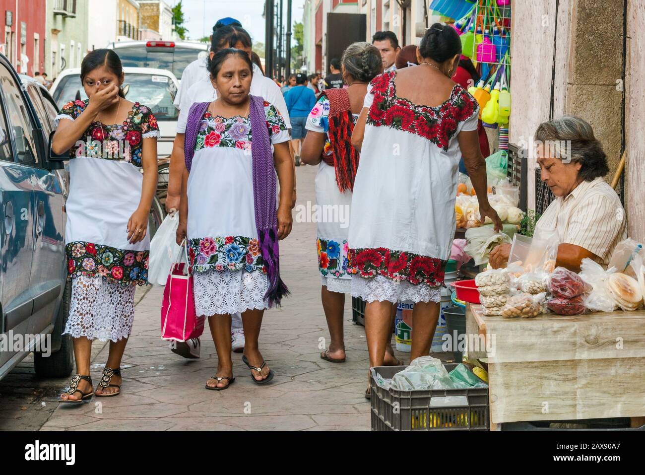 Women wearing huipiles, traditional hand-embroided Mayan dress, at Calle 44 in Valladolid, Yucatan state, Mexico Stock Photo