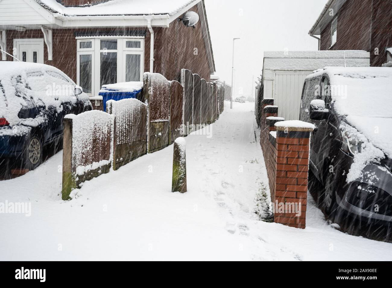 Heavy snow hits Stoke on Trent in the West Midlands after a storm suddenly appears, blanketing the city in ice and snow, snowy blizzard Stock Photo