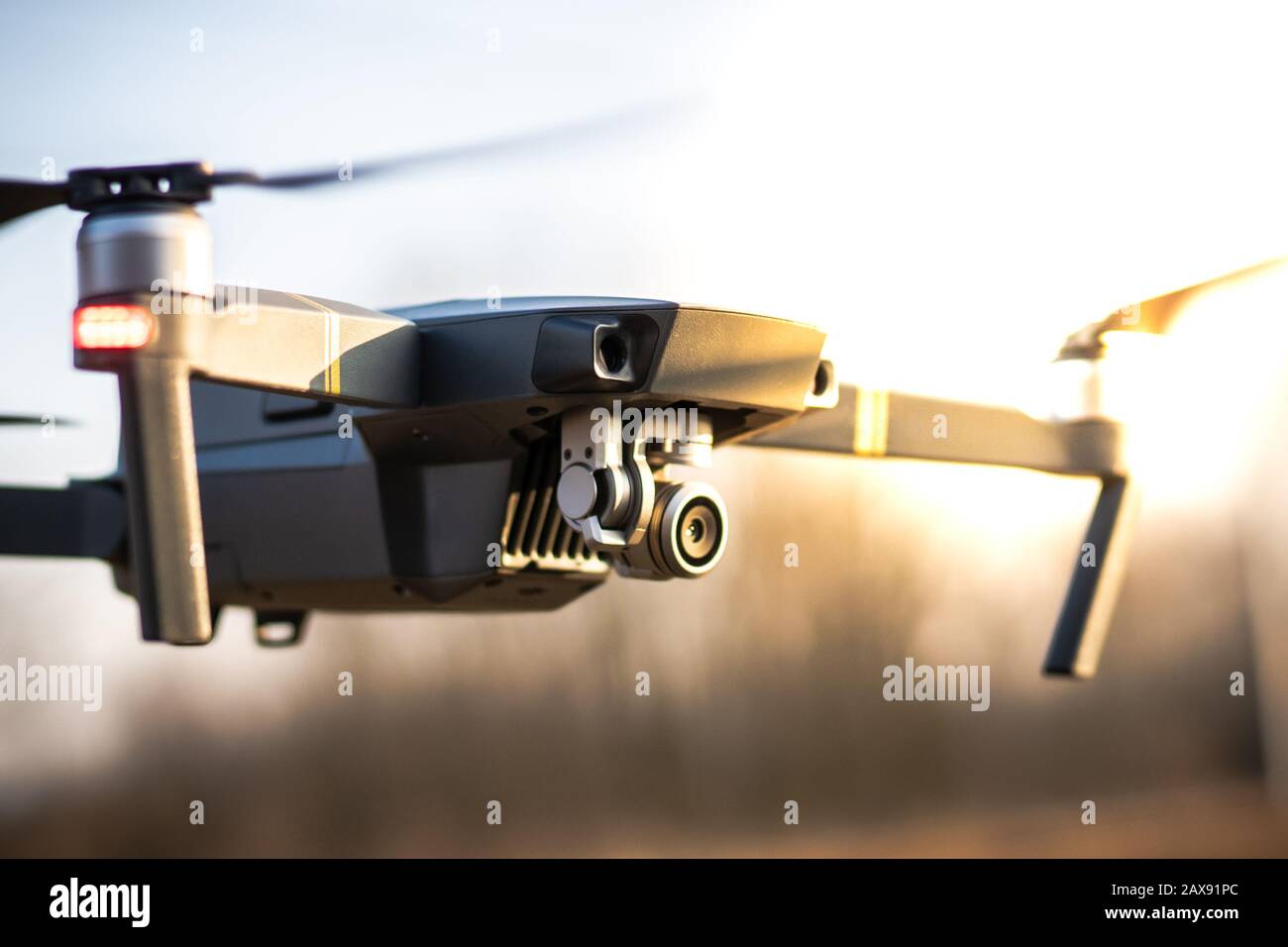 Flying drone with sunset view. Stock Photo