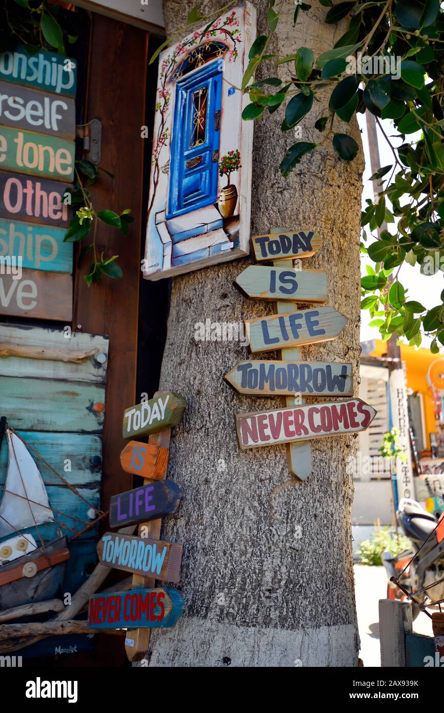 Matala, Greece - October 07, 2018: Colorful handicrafts with sayings and wisdoms in the village in the south of Crete Stock Photo