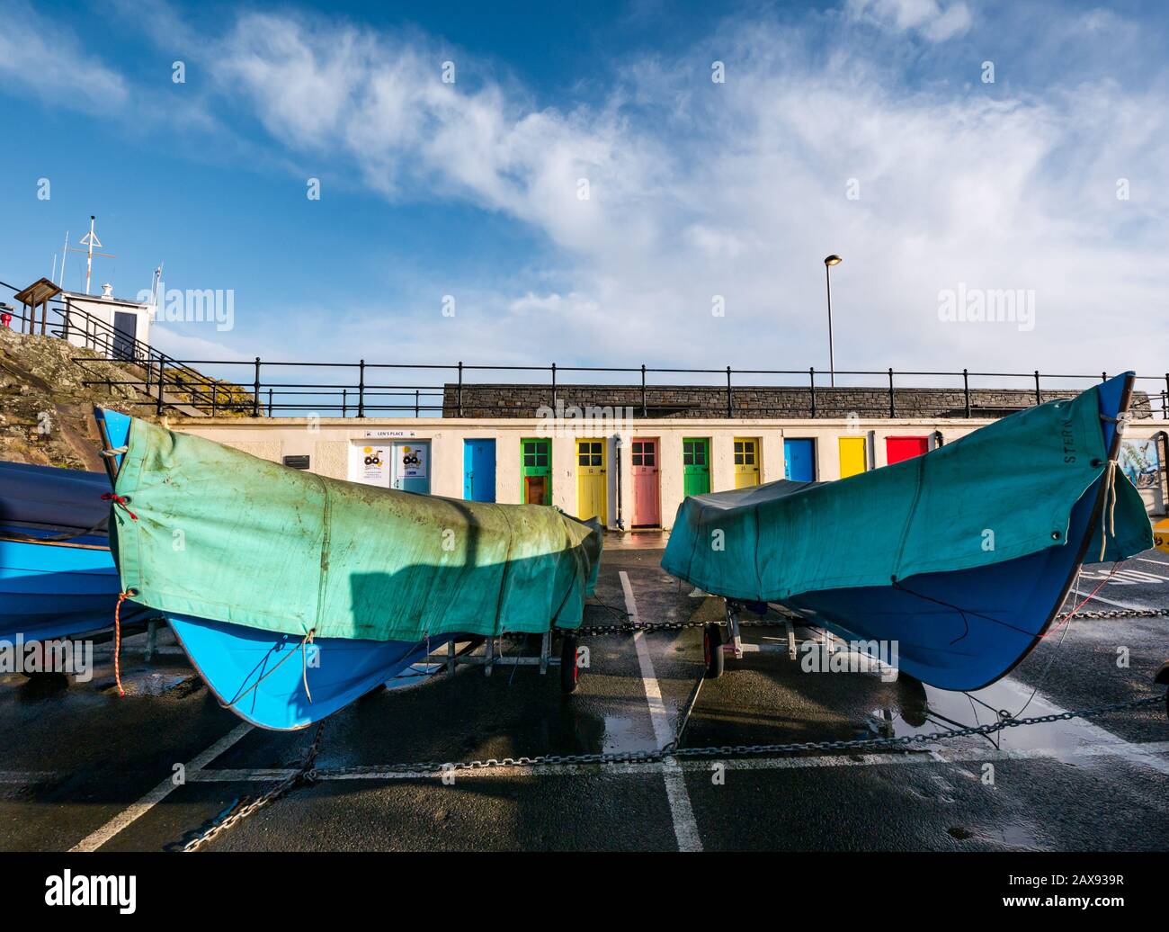 Colourful numbered doors in boat storage yard in Winter (former changing cubicles), North Berwick harbour, East Lothian, Scotland, UK Stock Photo