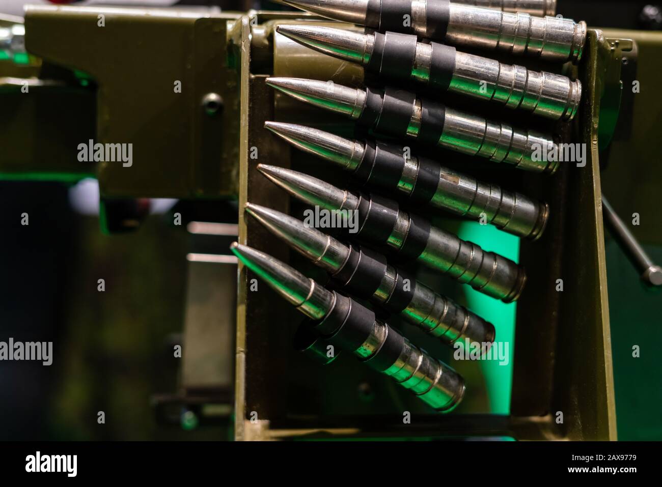 Bullet chain hanging of machine gun. Ammunition belt of cartridge Stock Photo