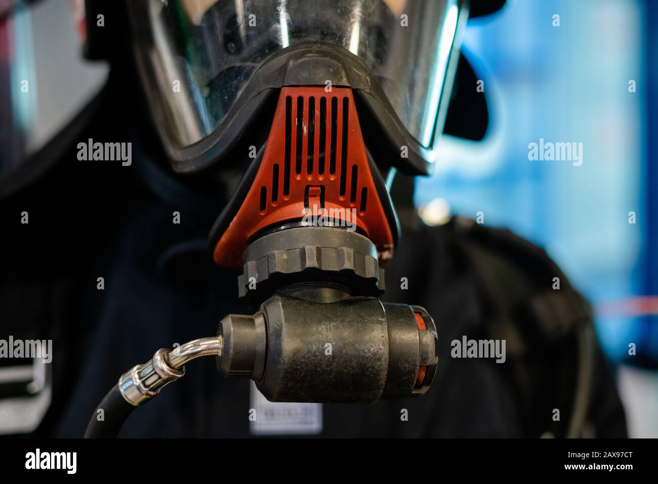 Close up of firefighter wearing oxygen mask. Coronavirus danger zone, fear of being infected. Using respirator Stock Photo