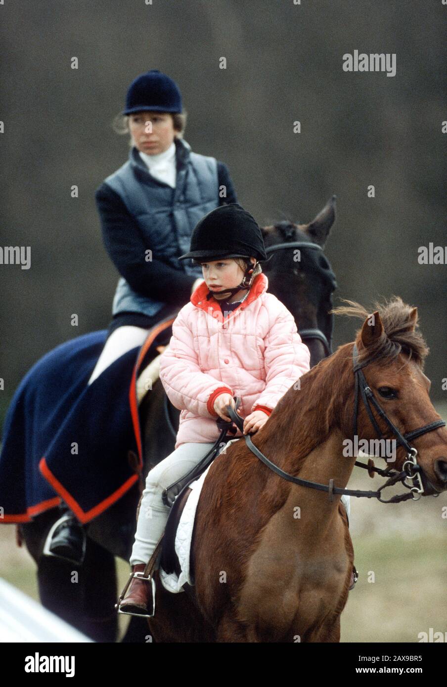 HRH Princess Anne (rear) and Zara Phillips at The Stoneaston Park Horse Trials, England, March 1989 Stock Photo