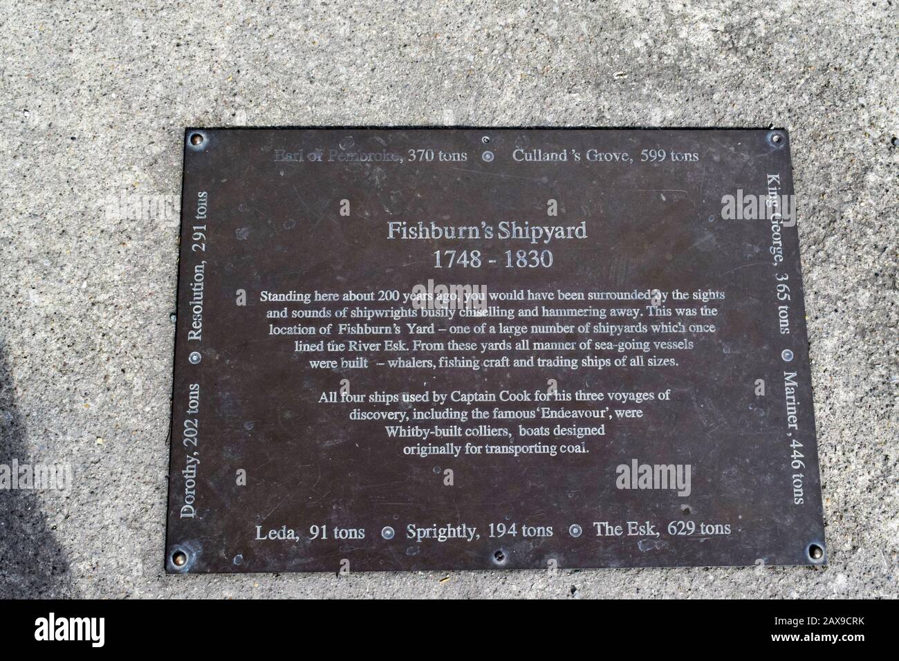 Commemoration plaque at the Fishburn Shipyard, Whitby , North Yorkshire, Whitby, where all four Captain Cook ships were built on his voyage to Australia (Endeavour, originally the Earl of Pembroke +  Adventure, Discovery and Resolution) plus others including those named on the plaque. Stock Photo