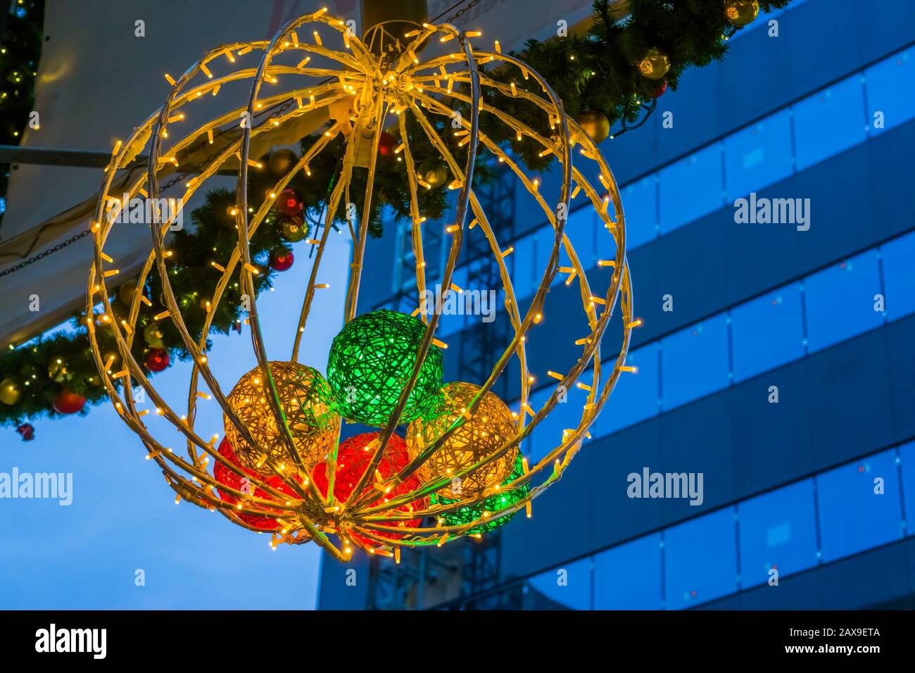 Beautiful lighted christmas decoration hanging in the city, Seasonal ...