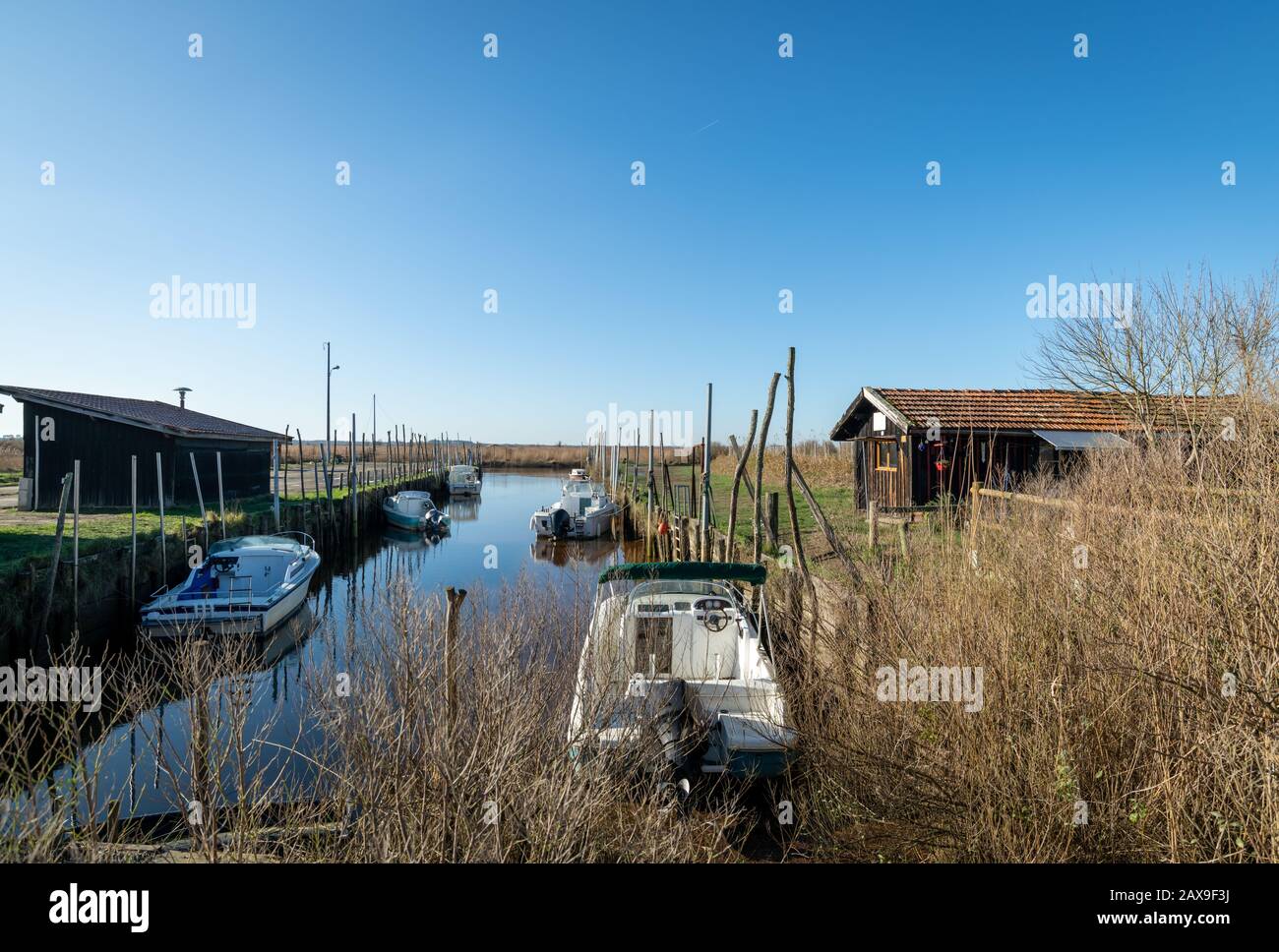 Arcachon bay, France. Boats on the river Leyre Stock Photo