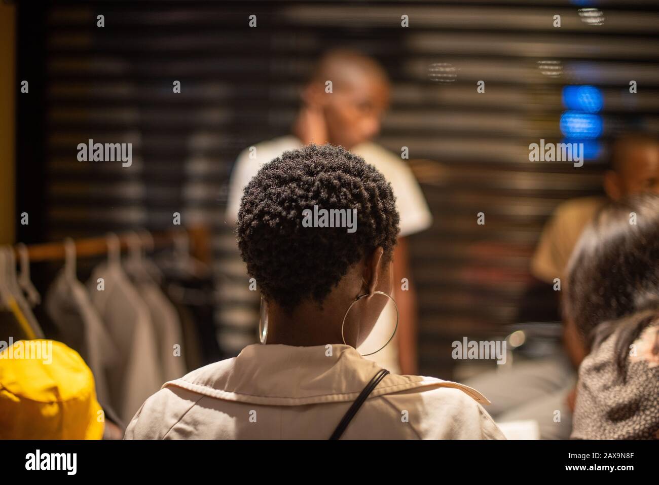 Woman hoop earrings hi-res stock photography and images - Alamy