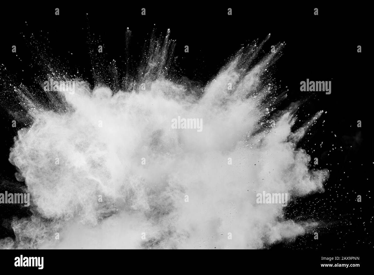 Abstract white powder explosion.White dust debris on black background