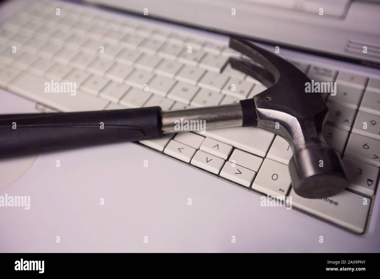 Close up of a hammer on an old laptop keyboard. Computer repair, customer  technical support service. Electronic and PC upgrade, fixing software and  ha Stock Photo - Alamy
