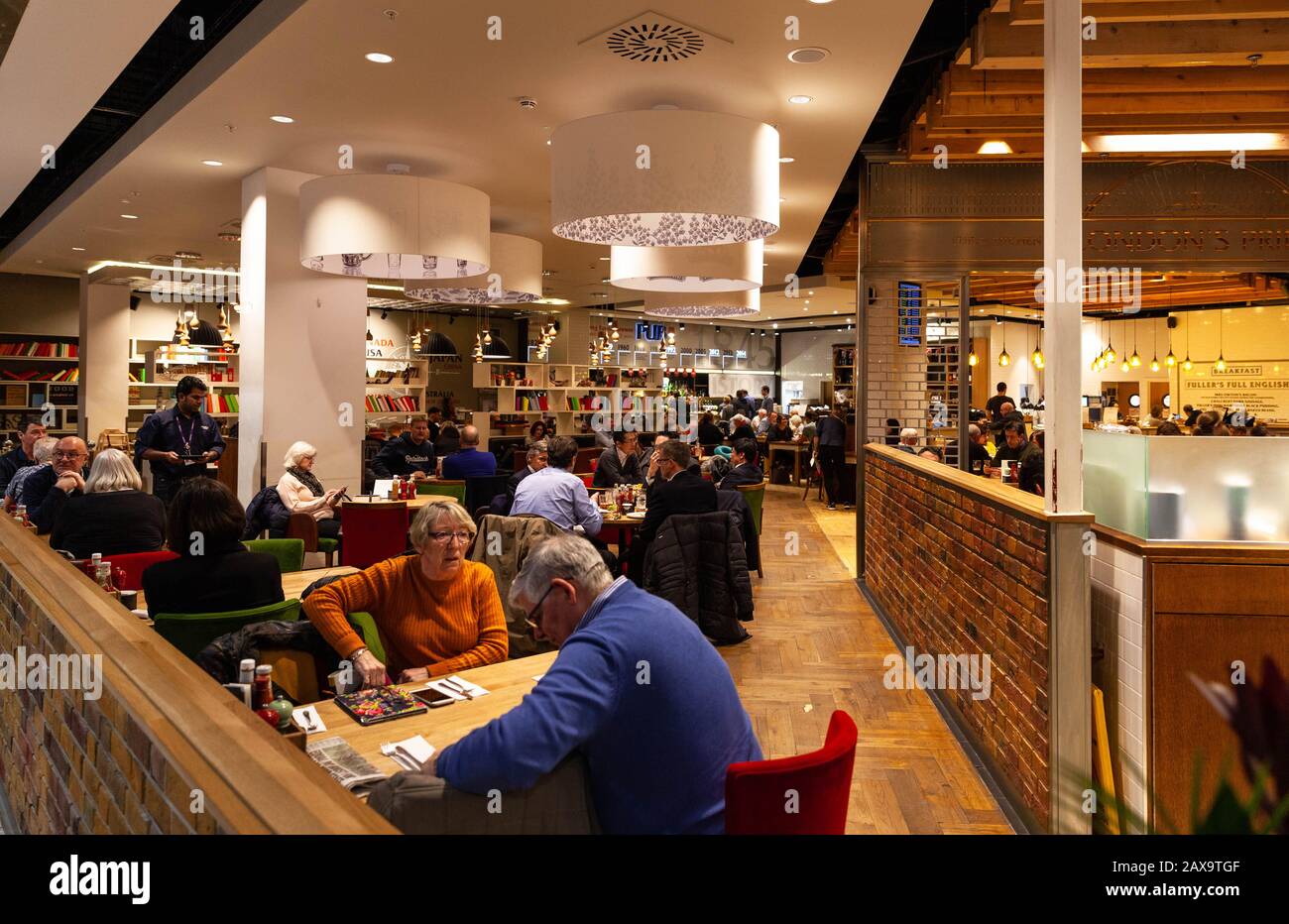 The busy interior of a pub-restaurant inside Stansted airport, England, UK. Stock Photo