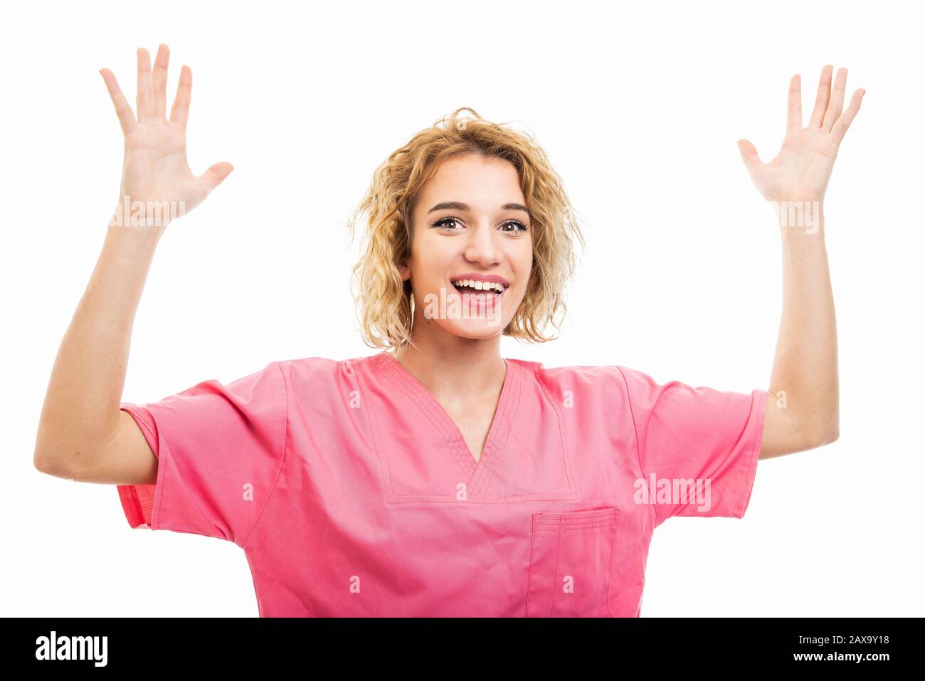 Portrait Of Nurse Wearing Pink Scrub Making Happy Gesture Isolated On