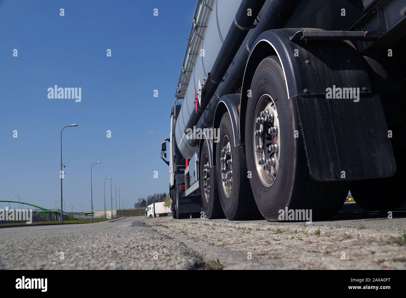 View from the road level. A powerful truck-tanker. Stock Photo