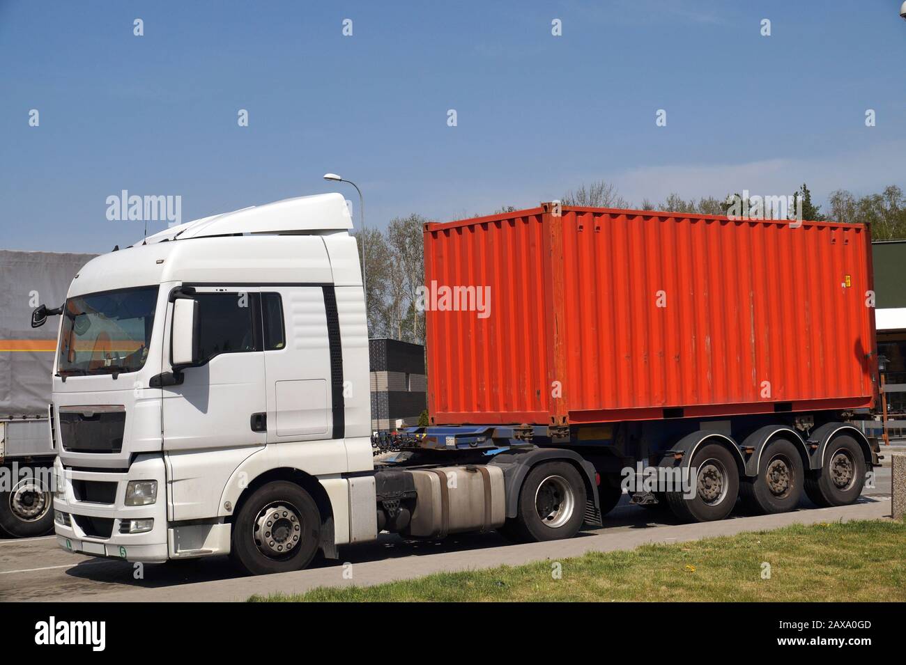 Transport by container truck. Truck in the parking lot during a travel break. Stock Photo
