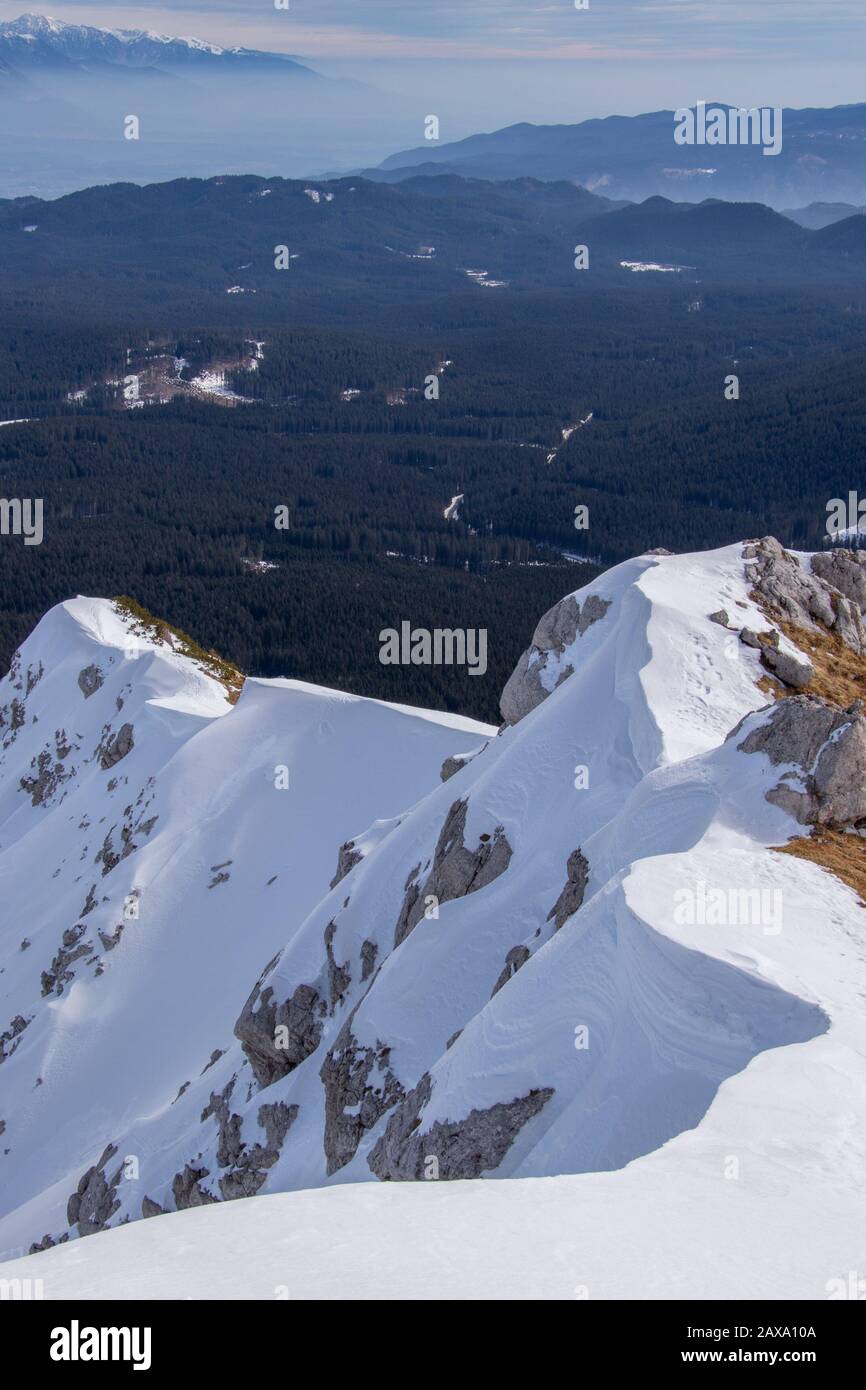 Mountain cliff covered in snow Stock Photo - Alamy