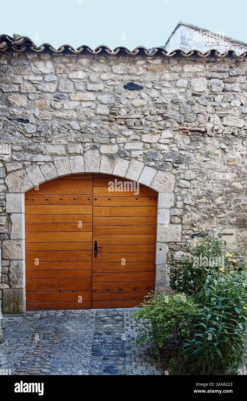 double wood door, old stone wall, arched, cobblestones, building ...