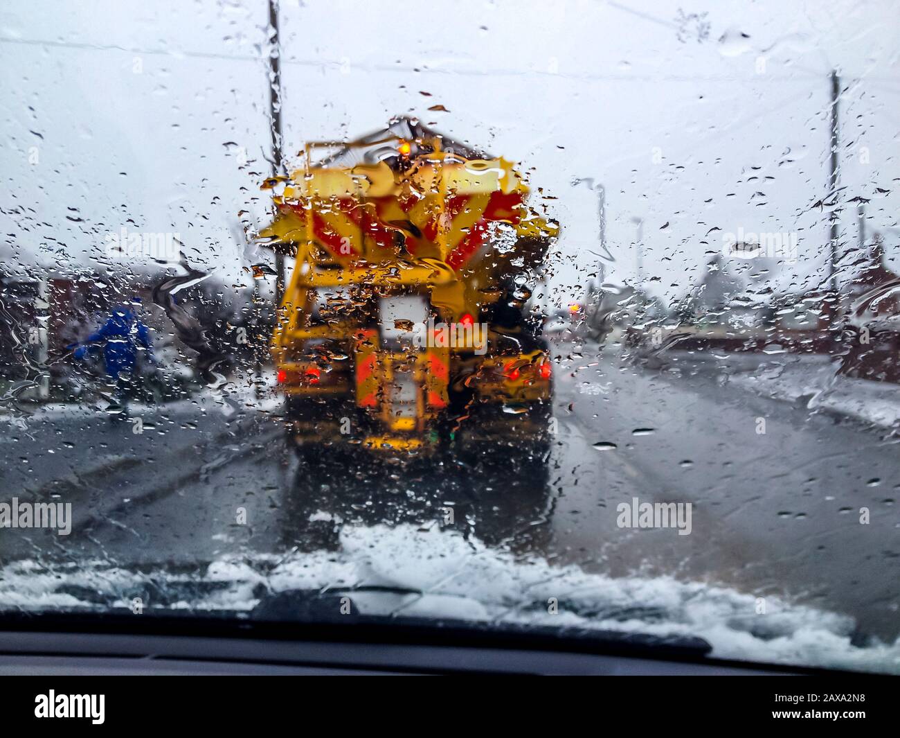 snow ice road gritter on road gritting in winter,england,uk Stock Photo