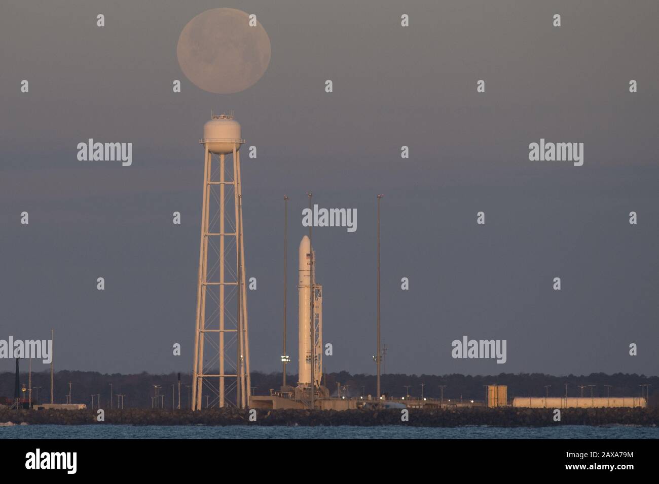 A Northrop Grumman Antares rocket carrying a Cygnus resupply spacecraft is seen at sunrise as the Moon sets on Pad-0A, on February 9, 2020, at NASA's Wallops Flight Facility in Virginia. Northrop Grumman's 13th contracted cargo resupply mission with NASA to the International Space Station will deliver about 7,500 pounds of science and research, crew supplies, and vehicle hardware to the orbital laboratory and its crew. The CRS-13 Cygnus spacecraft is named after the first African American astronaut, Major Robert Henry Lawrence Jr. NASA Photo by Aubrey Gemignani/UPI Stock Photo