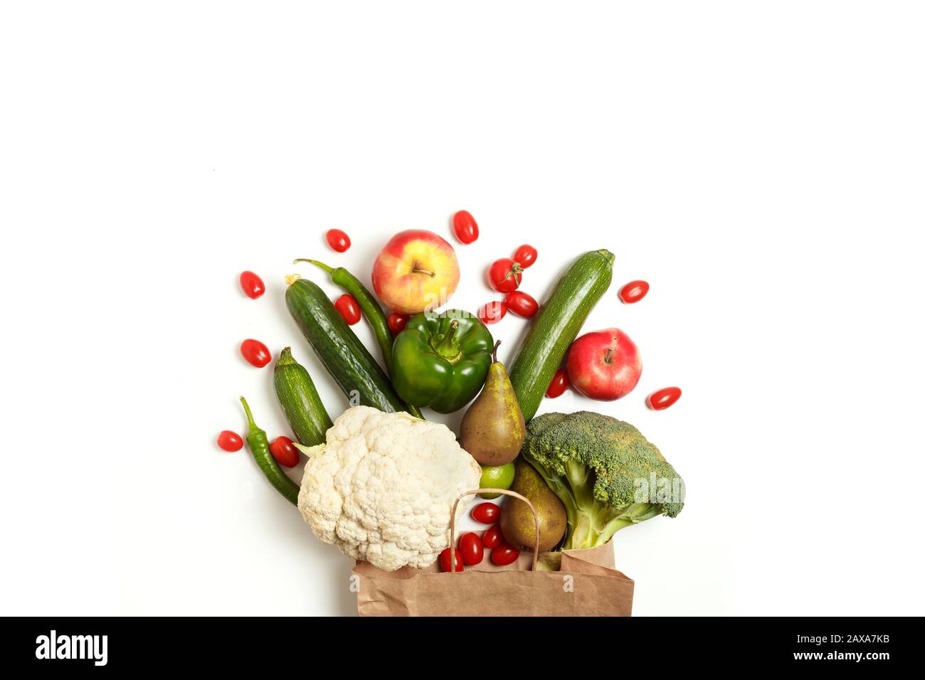 Paper bag of different healthy farm vegetables and fruits isolated on a ...