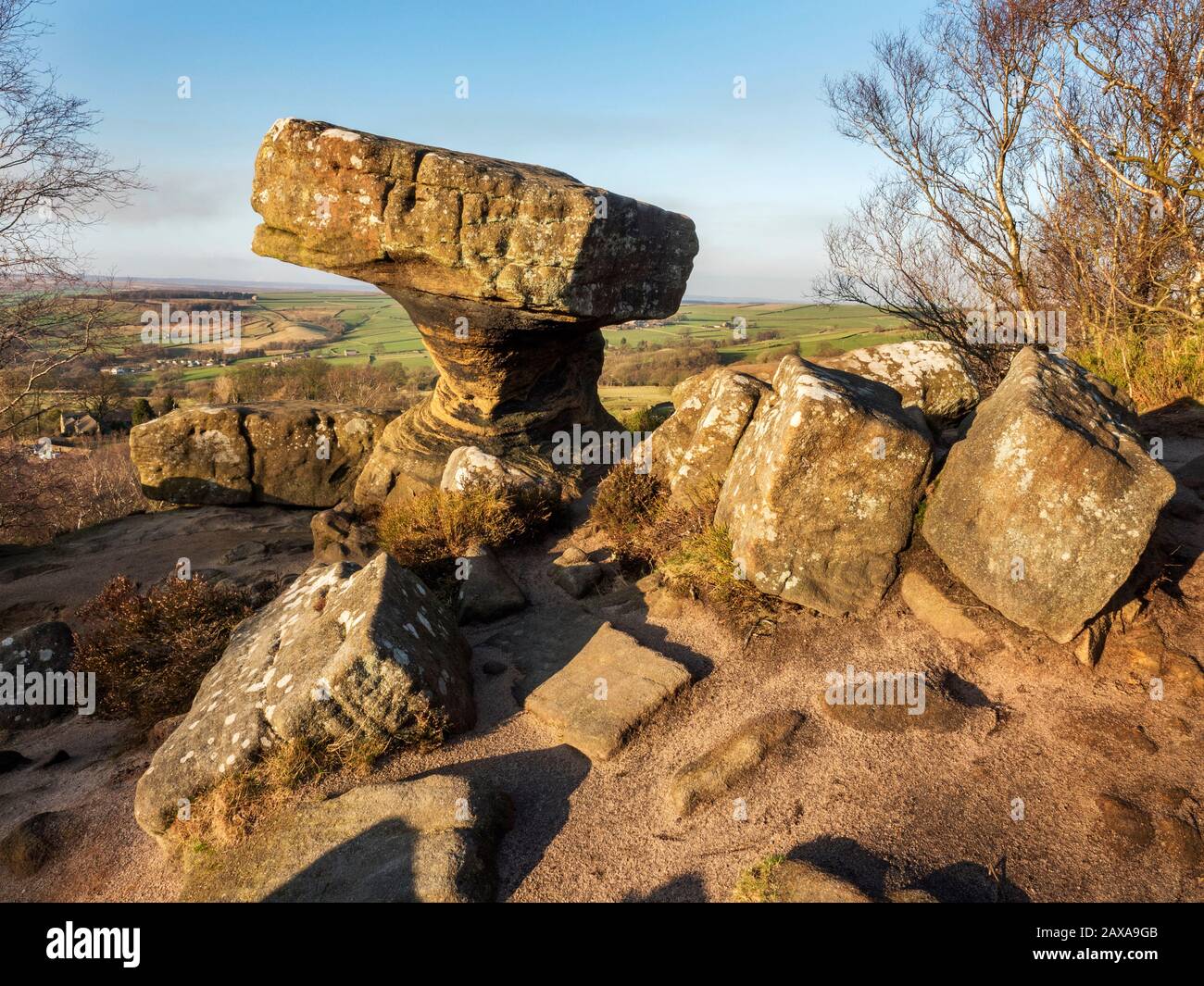 The Druids Writing Desk gritstone rock formation at sunset Brimham Rocks Brimham Moor Nidderdale AONB North Yorkshire England Stock Photo