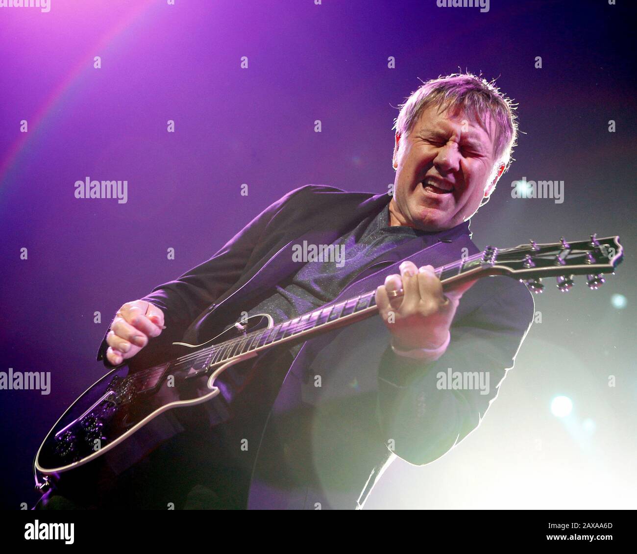 Rush's Alex Lifeson performs with Neil Peart and Geddy Lee at the BB&T ...