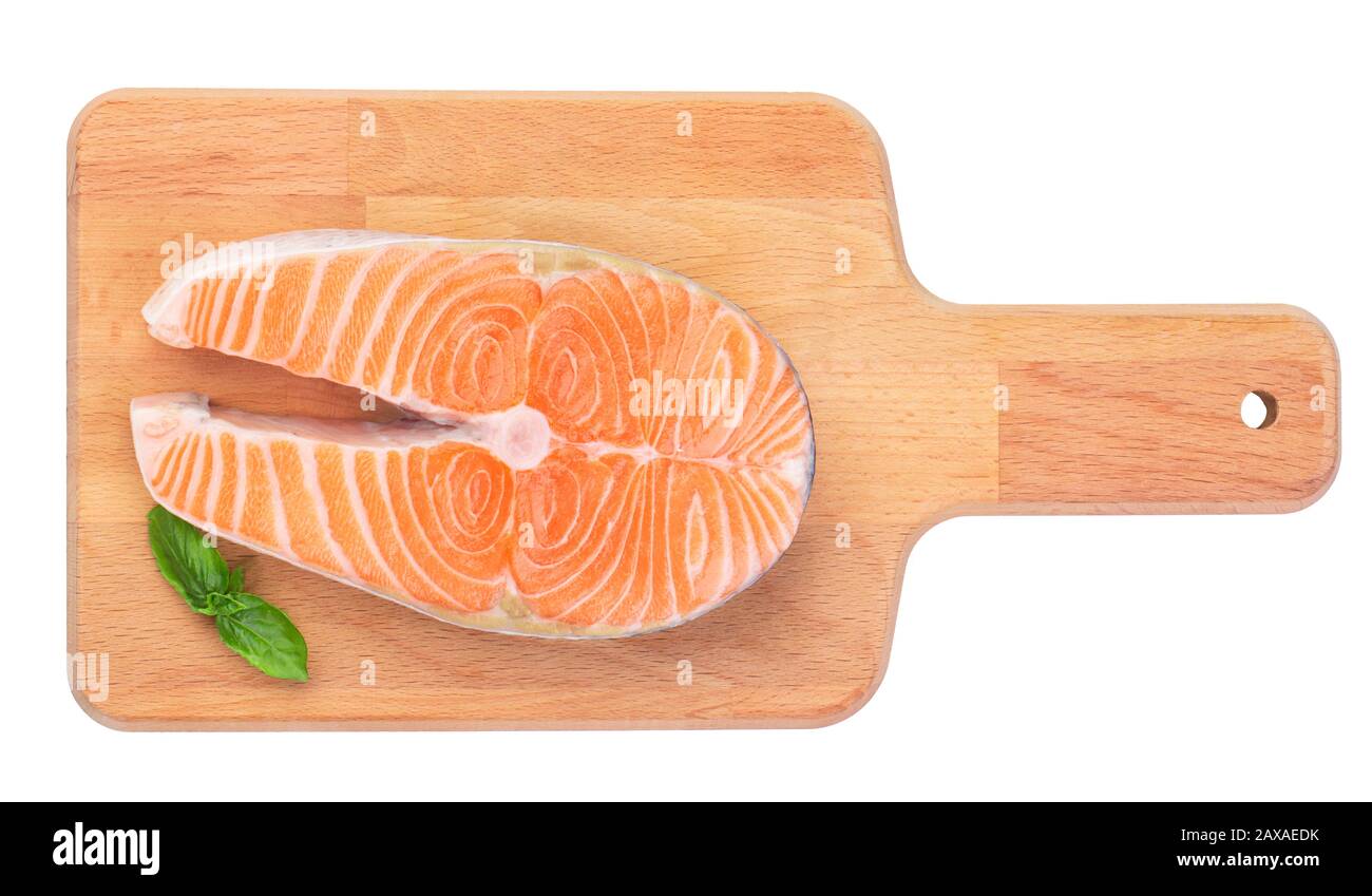 The only raw steak of wild salmon on a wooden kitchen board Stock Photo