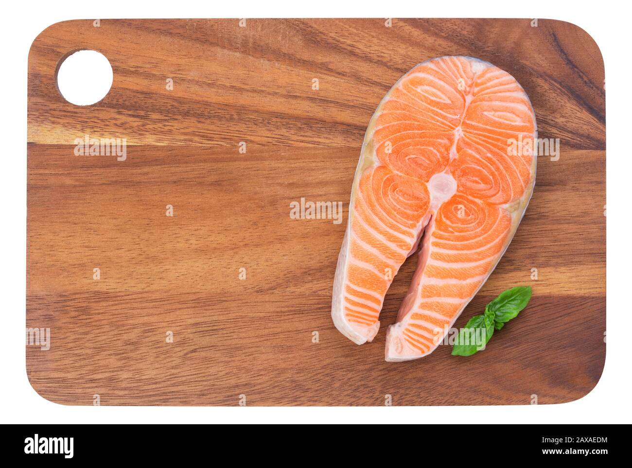 The only raw steak of wild salmon on a wooden kitchen board Stock Photo