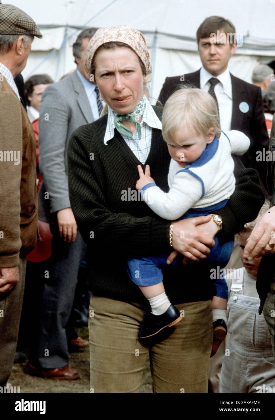 HRH Princess Anne carries her daughter, Zara Phillips at the Badminton Horse Trials, England April 1982 Stock Photo