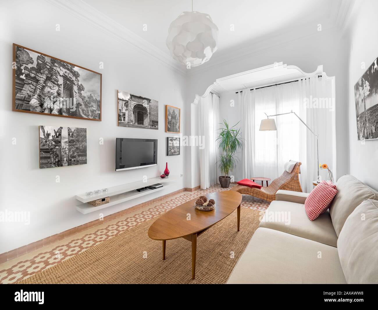 Cozy Scandi Boho Living Room With Natural Ratan Carpet Sofa Wooden Table Plants And Gallery On Wall Spacious Modern Interior In Earthy Colors Stock Photo Alamy