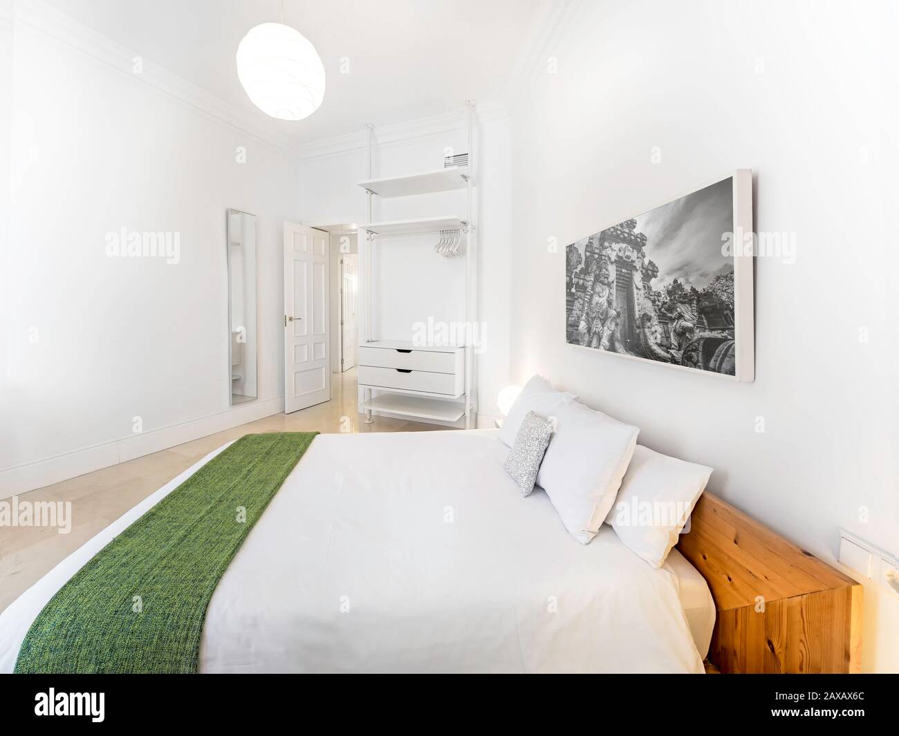 Clean Bright Bedroom With King Size Bed Duvet Side Tables Lamps
