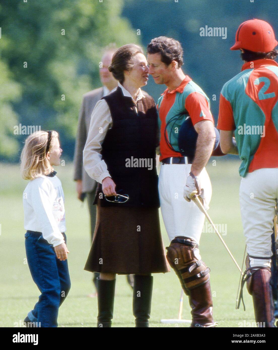 Hrh Prince Charles Receives A Kiss From His Sister Hrh Princess Anne Watched By Zara Phillips At Cirencester Park Polo Club Cirencester England Stock Photo Alamy
