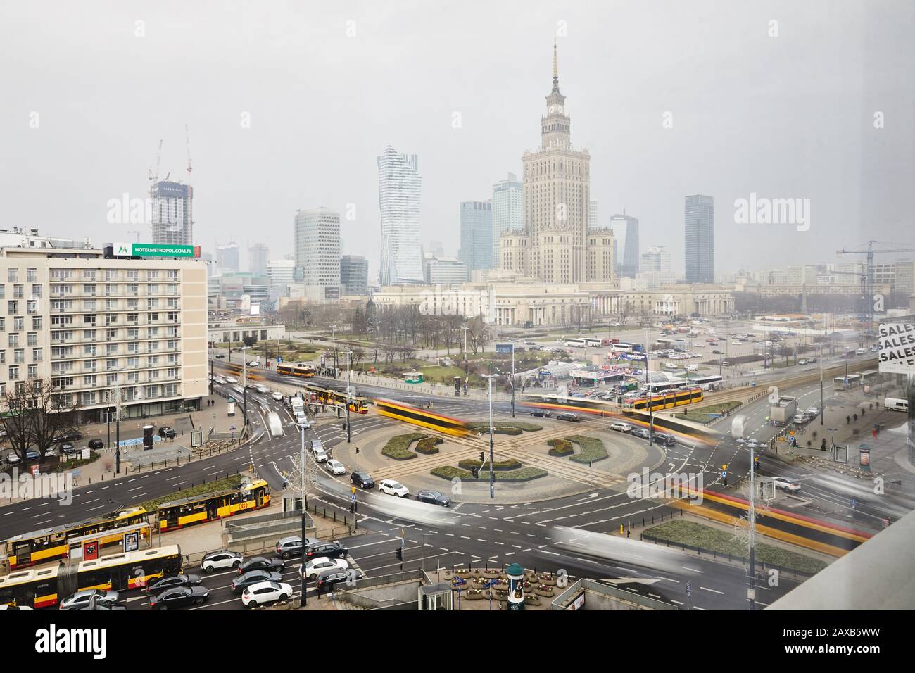 Cityscape of Warsaw, capital of Poland. View on Palace of Culture and Science, skyscrapers, Dmowski roundabout, trams and city traffic. Stock Photo