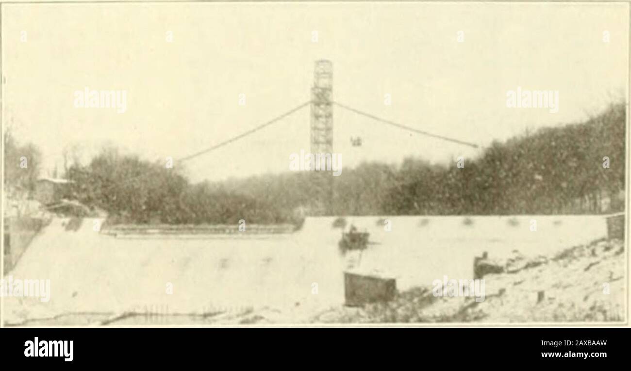 Engineering and Contracting . Fig. 2. Dam Under Construction, CuyahogaRiver Hydro-Electric Development. t-ig. J. D.-.ni iNenny Completed, CuyahogaRiver HyrdoElectric Development. The receiver is also made of /2-in. metal.Soft basic open-hearth steel was used for allthe above work. All circular .scams aresingle riveted, while all longitudinal scamsare double riveted, the sizes of the rivetsvarying from %-in. at the upper end to 1-in.at the lower end. The hydraulic equipment consists of three750-IlP.Trump horizontal turbines which aredirect connected to the generators by meansof a flexible coupl Stock Photo