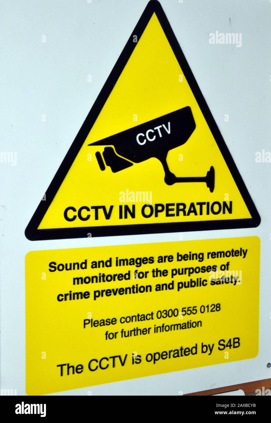 A sign to inform people that closed circuit television is in operation outside a car park in Manchester, uk, in order to deter crime Stock Photo