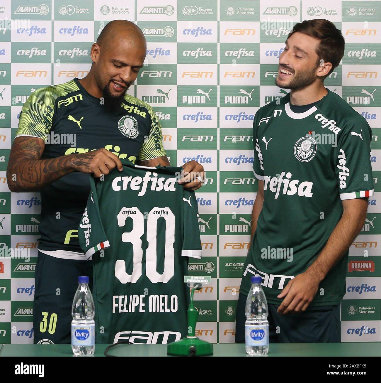 SÃO PAULO, SP - 11.02.2020: APRESENTAÇÃO MATÍAS VIñA PALMEIRAS - Felipe Melo  (E), from SE Palmeiras, delivers a shirt to the newest heel of the club  Matías Viña, at the Football Academy. (