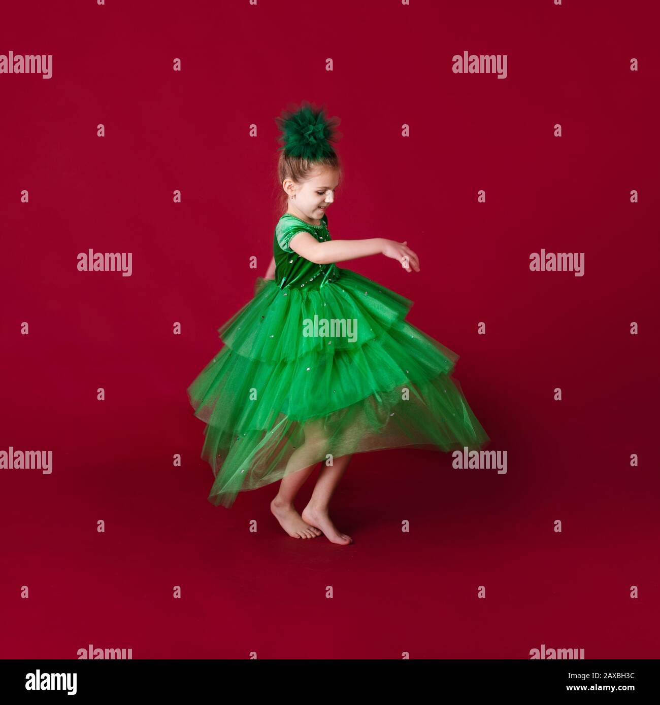 Beautiful Little Girl Princess Dancing In Luxury Green Dress Isolated beautiful-little-girl-princess-dancing-in-luxury-green-dress-isolated