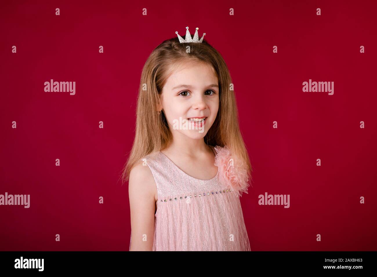 Beautiful little girl princess dancing in luxury pink and silver dress ...