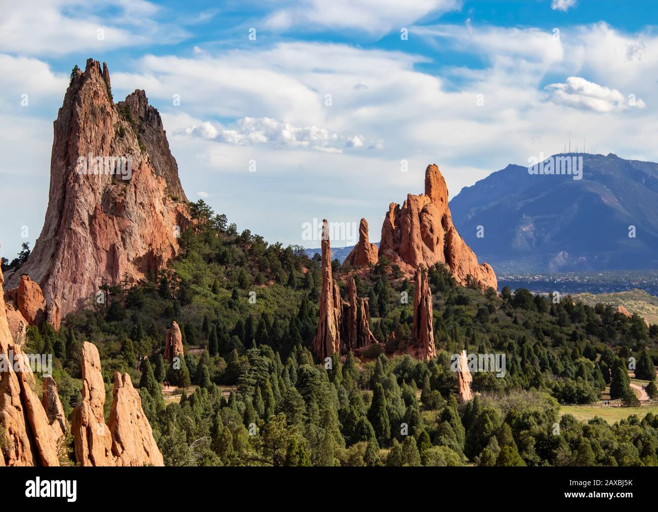 The towering red rock formations of the Garden of the Gods of Colorado Springs with Cheyenne Mountain in the background Stock Photo