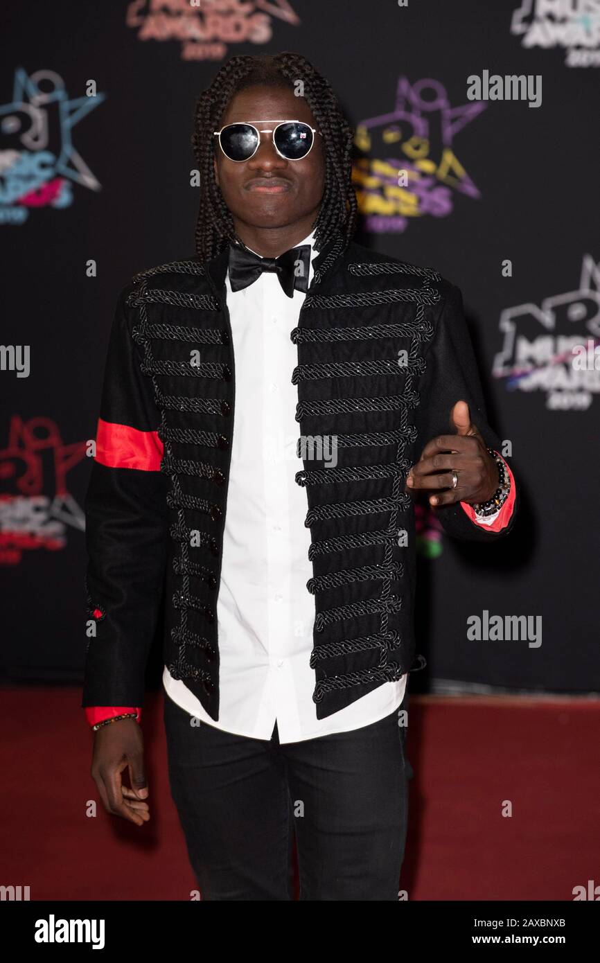 Salif Gueye, alias 'Salif la Source, on the red carpet before the 2019 NRJ Music Awards ceremony in Cannes (south-eastern France), at the “Palais des Stock Photo