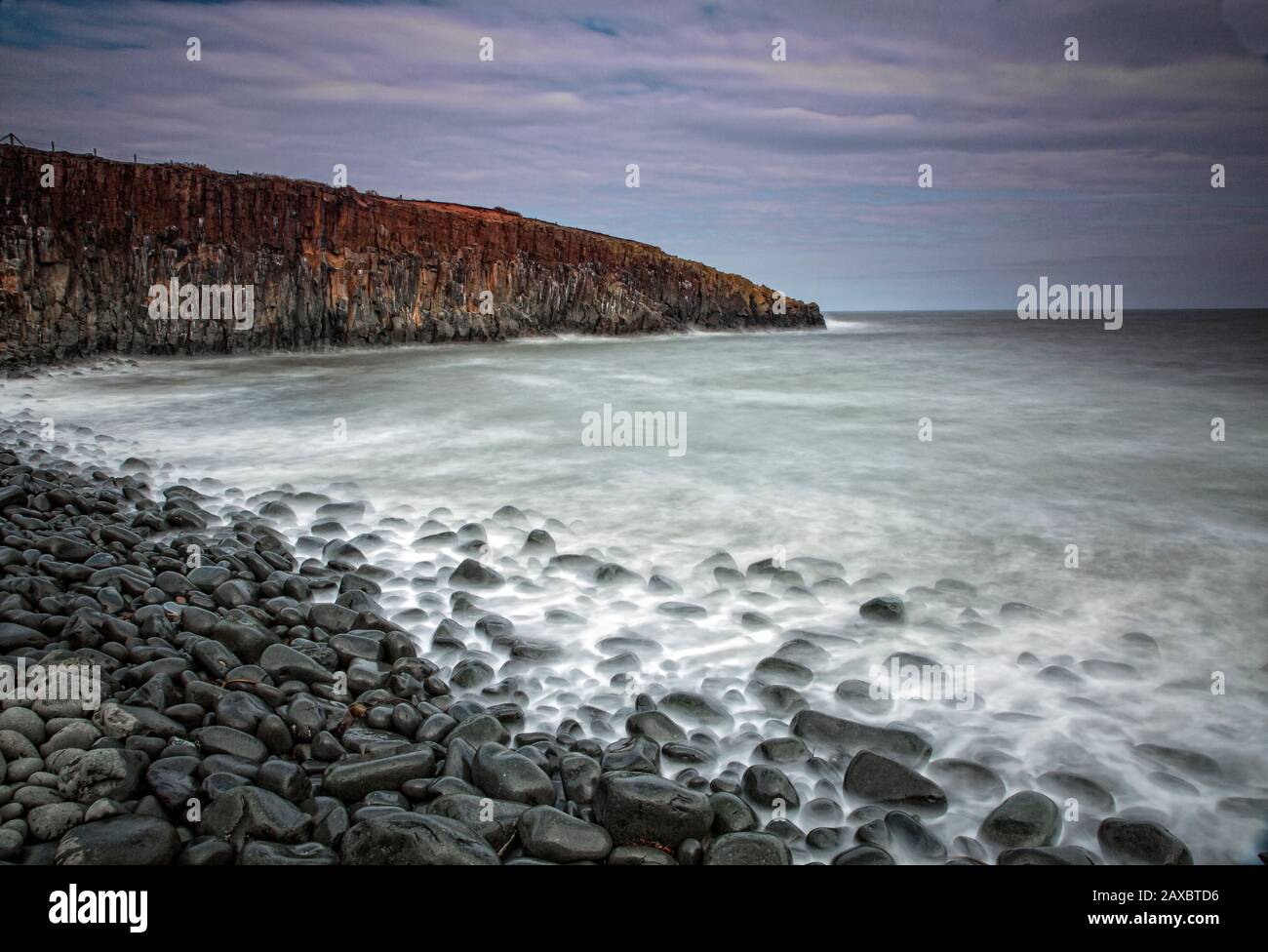 Rocks on remote ocean beach Cullernose Point Craster Northumberland UK Stock Photo