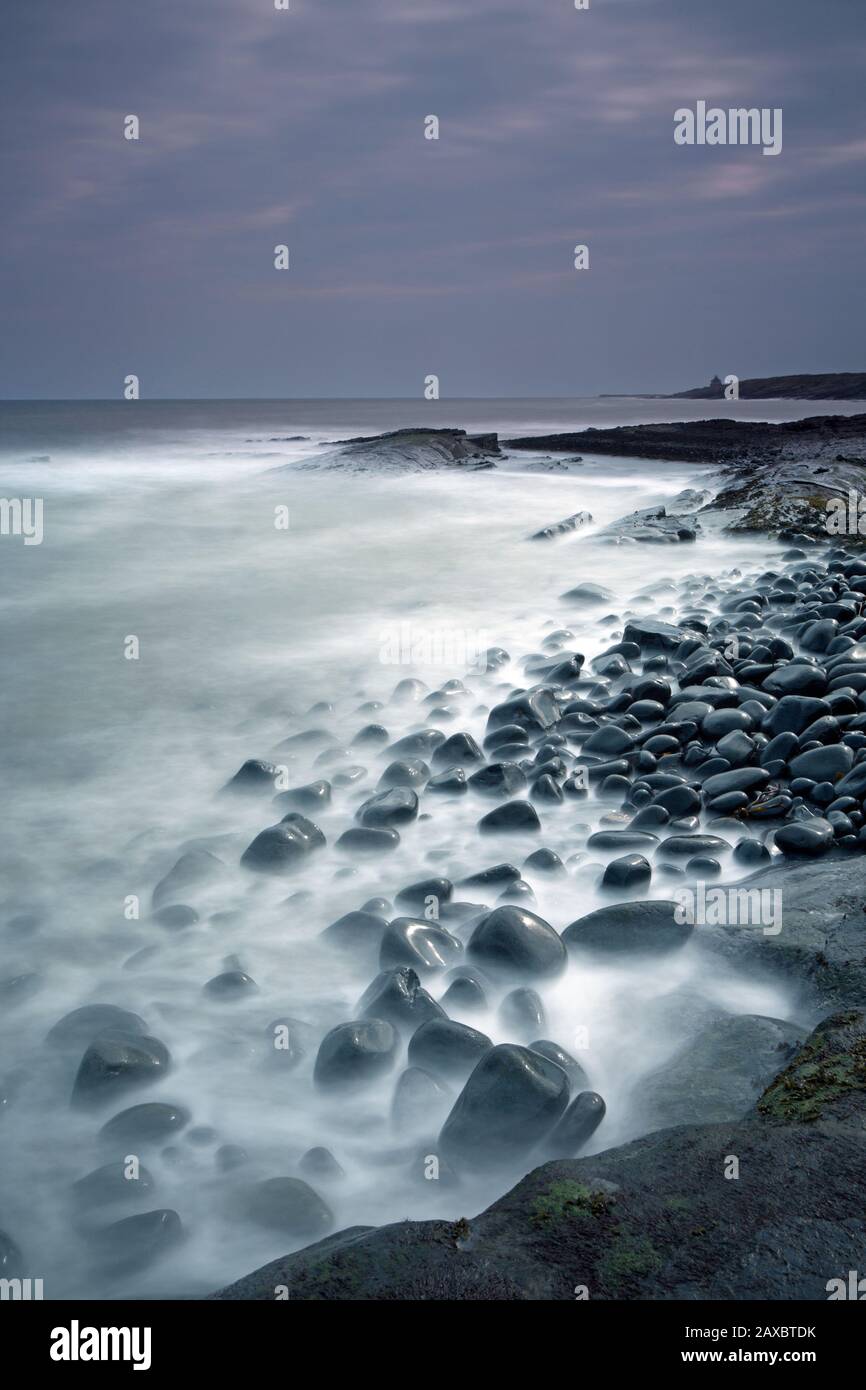 Rocks mystical ocean Cullernose Point Craster Northumberland UK Stock Photo