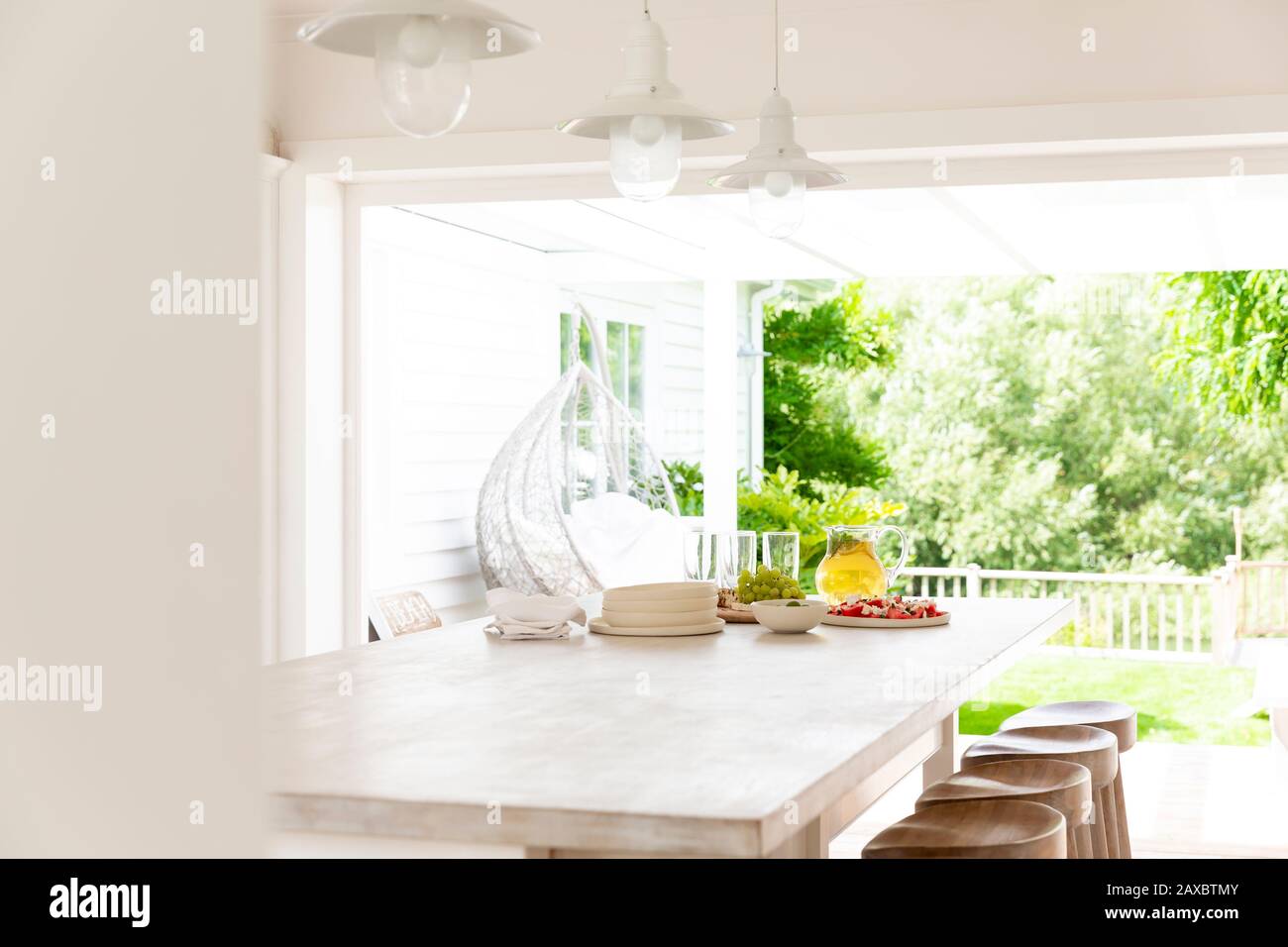 Home showcase kitchen open to summer patio Stock Photo