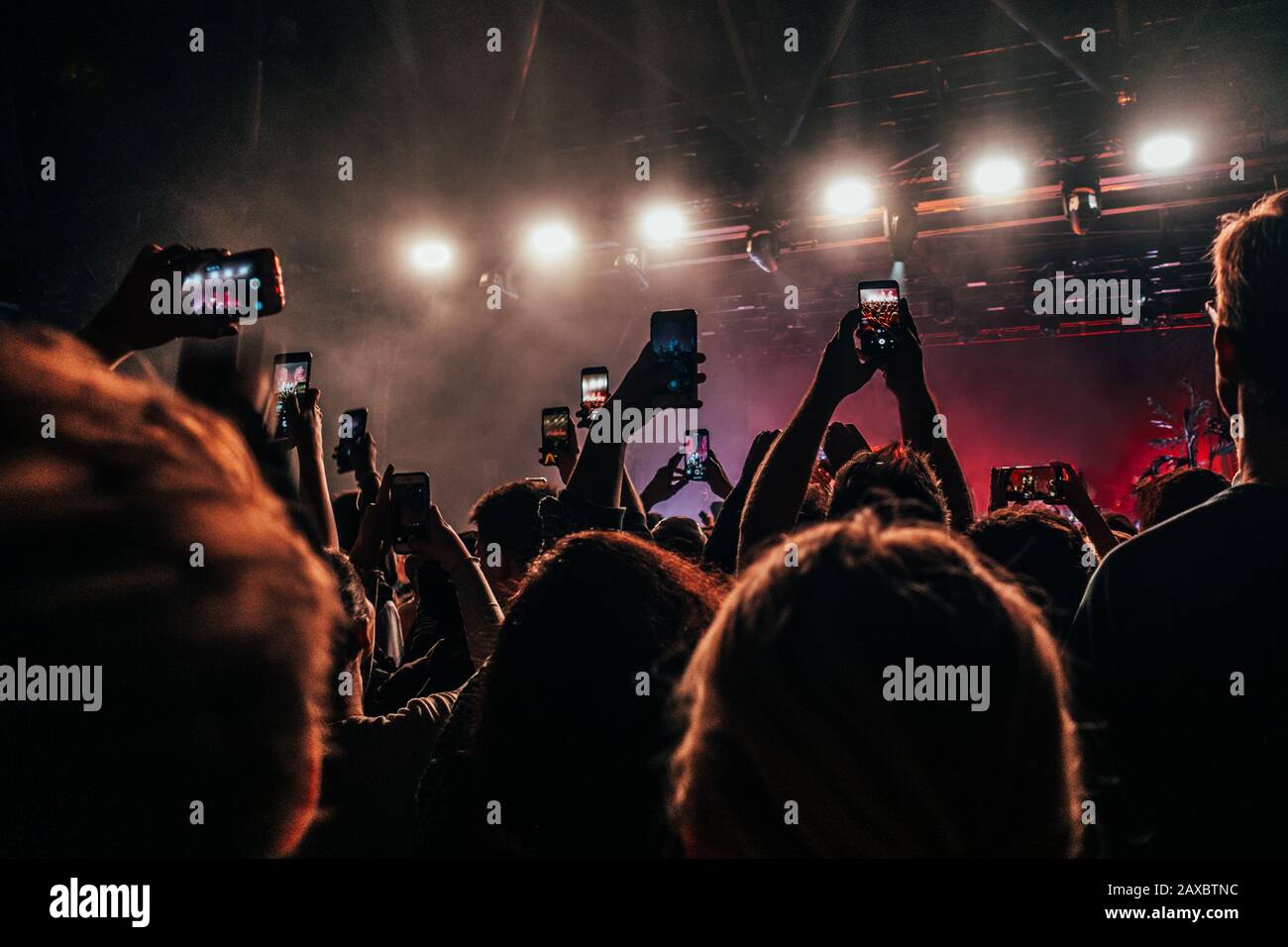 Crowd with smart phones filming music concert Stock Photo