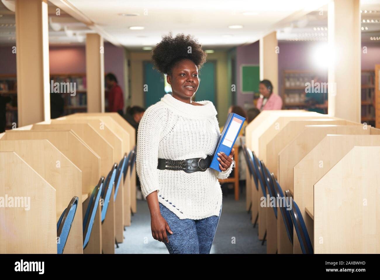 Portrait confident young female college student in computer lab Stock Photo