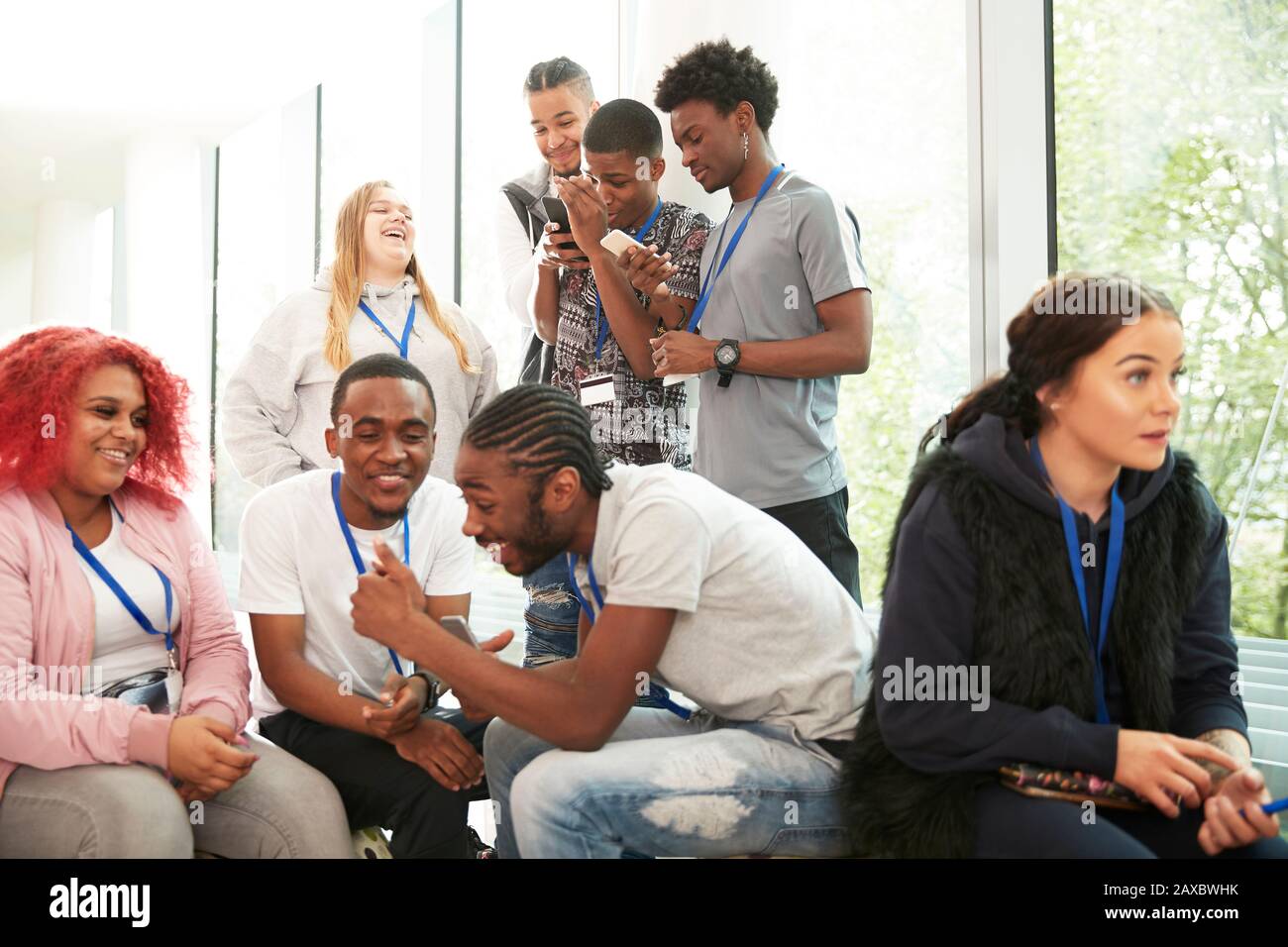 College students using smart phones and hanging out Stock Photo